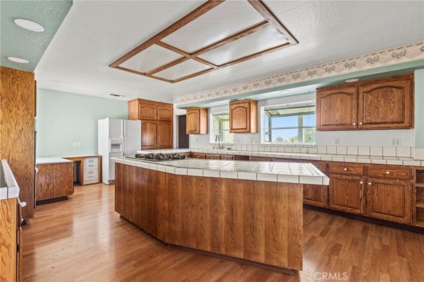 Interior, Kitchen, Recessed Lighting, Tile Countertops, Wood Texture Flooring