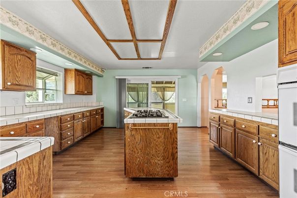 Interior, Kitchen, Recessed Lighting, Tile Countertops, Wood Texture Flooring
