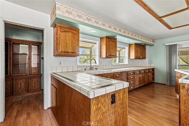 Interior, Kitchen, Recessed Lighting, Tile Countertops, Wood Texture Flooring
