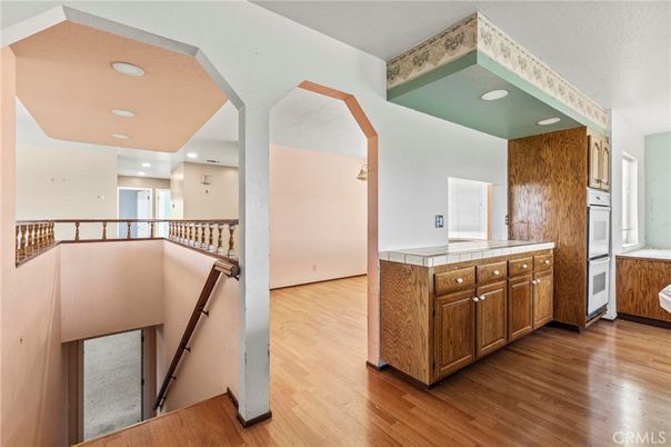 Interior, Kitchen, Recessed Lighting, Tile Countertops, Wood Texture Flooring