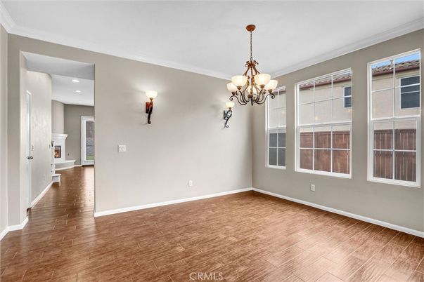 Chandelier, Empty room, Fireplace, Interior, Recessed Lighting, Wood Texture Flooring