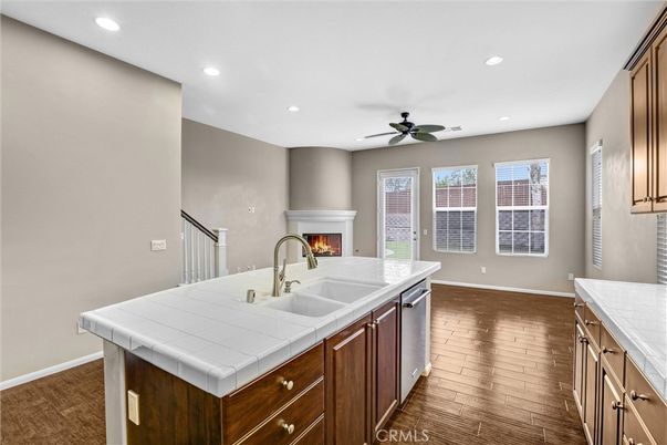 Fireplace, Interior, Kitchen, Recessed Lighting, Tile Countertops, Wood Texture Flooring