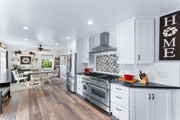 Dining room, Interior, Kitchen, Recessed Lighting, Stainless Steel Appliances, Wood Texture Flooring