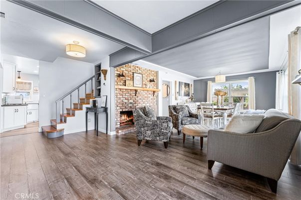 Dining room, Fireplace, Interior, Kitchen, Living room, Pendant Lights, Stone Walls, Wood Texture Flooring