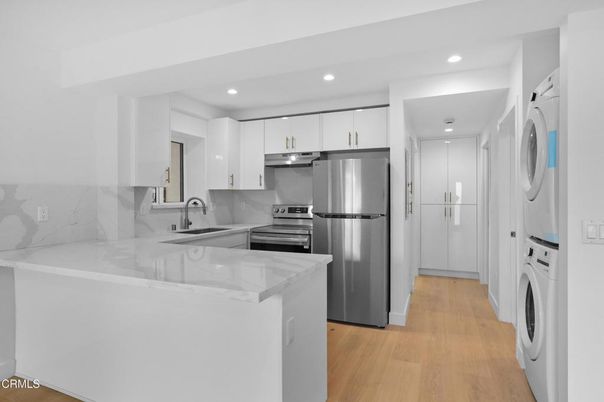 Interior, Kitchen, Recessed Lighting, Stainless Steel Appliances, Washer, Wood Texture Flooring
