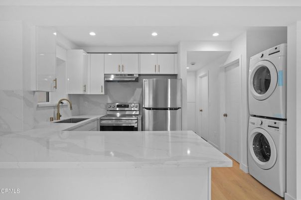 Interior, Kitchen, Recessed Lighting, Stainless Steel Appliances, Washer, Wood Texture Flooring