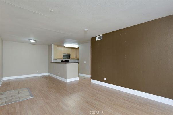 Empty room, Interior, Kitchen, Stainless Steel Appliances, Wood Texture Flooring