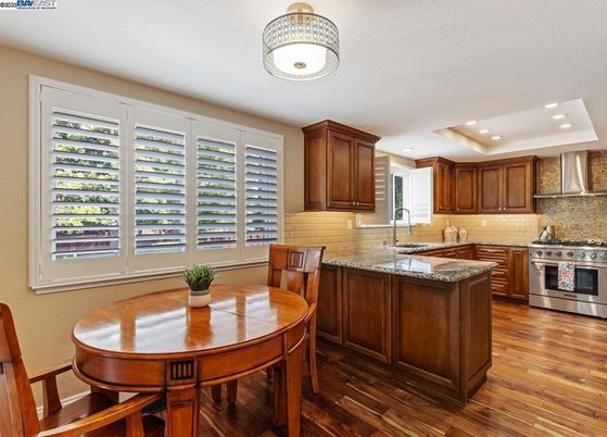 Dining room, Interior, Kitchen, Recessed Lighting, Stainless Steel Appliances, Wood Texture Flooring