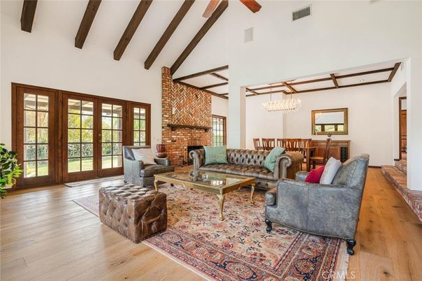 Chandelier, Dining room, Fireplace, Interior, Living room, Stone Walls, Wooden Beams, Wood Texture Flooring