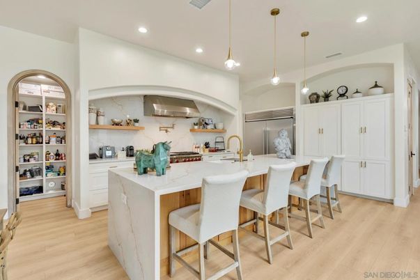 Interior, Kitchen, Marble Walls, Pendant Lights, Recessed Lighting, Stainless Steel Appliances, Wood Texture Flooring