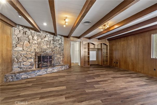 Empty room, Fireplace, Interior, Recessed Lighting, Stone Walls, Wooden Beams, Wood Texture Flooring, Wooden Walls