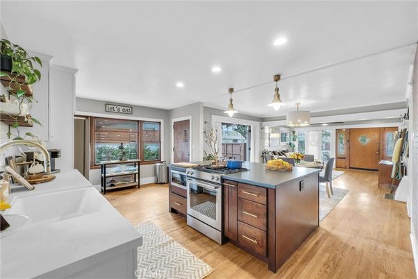 Dining room, Interior, Kitchen, Pendant Lights, Recessed Lighting, Stainless Steel Appliances, Wood Texture Flooring