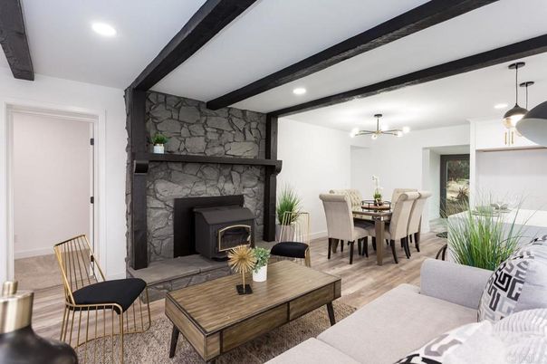 Dining room, Fireplace, Interior, Living room, Pendant Lights, Recessed Lighting, Stone Walls, Wooden Beams, Wood Texture Flooring