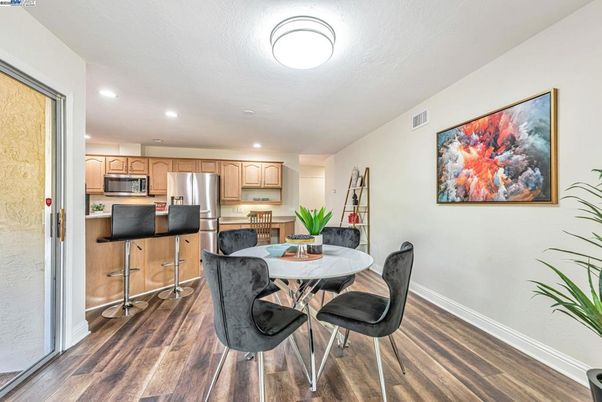 Dining room, Interior, Kitchen, Recessed Lighting, Stainless Steel Appliances, Wood Texture Flooring