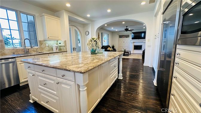 Fireplace, Interior, Kitchen, Recessed Lighting, Stainless Steel Appliances, Wood Texture Flooring