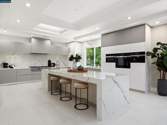 Interior, Kitchen, Marble Walls, Recessed Lighting, Stainless Steel Appliances