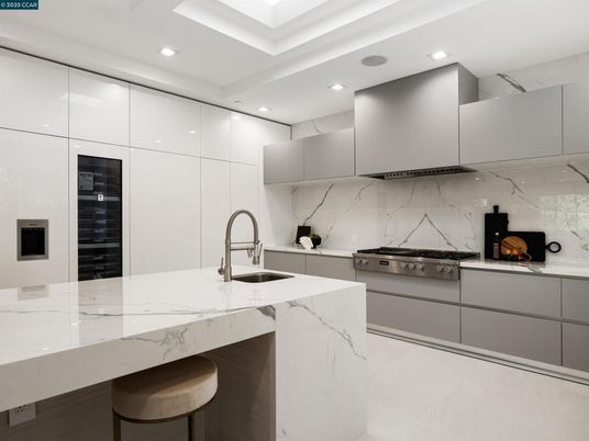 Interior, Kitchen, Marble Walls, Recessed Lighting, Stainless Steel Appliances