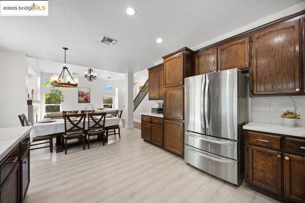 Chandelier, Dining room, Interior, Kitchen, Pendant Lights, Recessed Lighting, Stainless Steel Appliances, Wood Texture Flooring