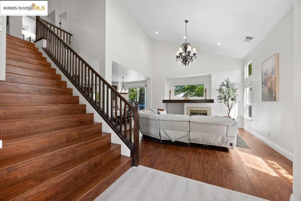 Chandelier, Fireplace, Interior, Living room, Recessed Lighting, Wood Texture Flooring