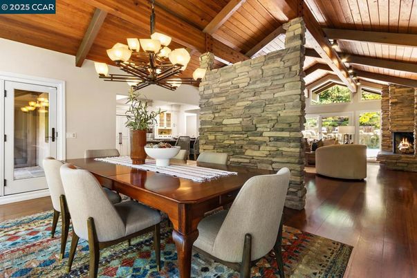 Chandelier, Dining room, Fireplace, Interior, Living room, Stone Walls, Wooden Beams, Wooden Ceilings, Wood Texture Flooring