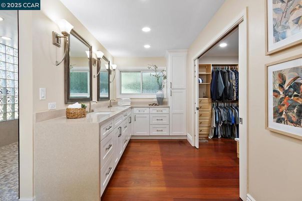 Bathroom, Dual Sink Vanities, Interior, Recessed Lighting, Walk-in Closets, Wood Texture Flooring