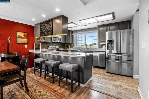 Interior, Kitchen, Recessed Lighting, Stainless Steel Appliances, Wood Texture Flooring
