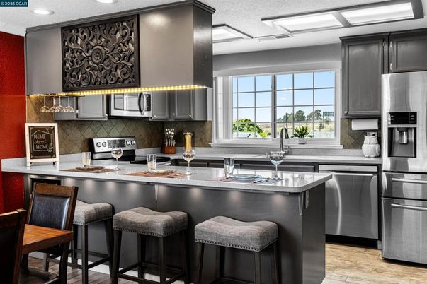 Interior, Kitchen, Recessed Lighting, Stainless Steel Appliances, Wood Texture Flooring