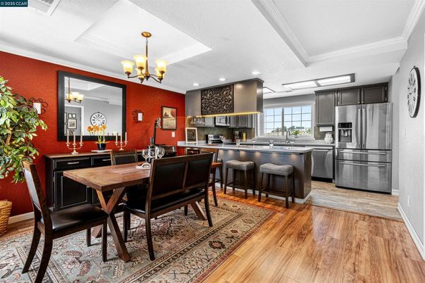Chandelier, Dining room, Interior, Kitchen, Recessed Lighting, Stainless Steel Appliances, Wood Texture Flooring