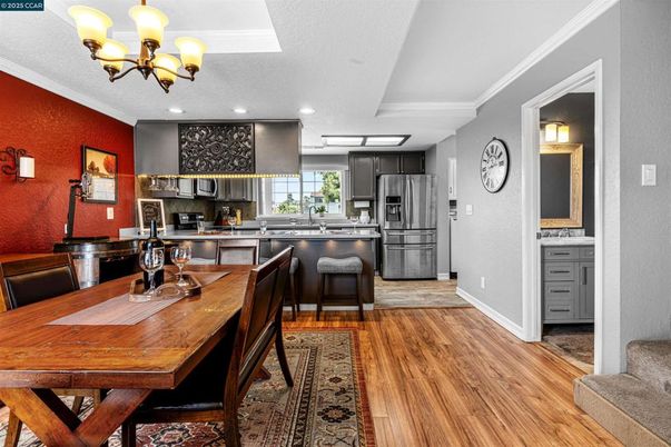 Chandelier, Dining room, Interior, Kitchen, Recessed Lighting, Stainless Steel Appliances, Wood Texture Flooring