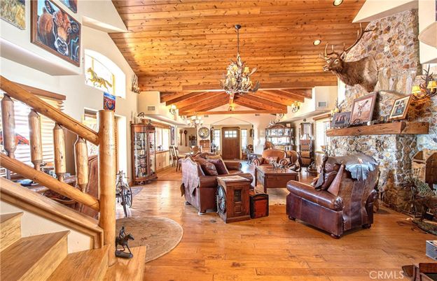 Chandelier, Dining room, Fireplace, Interior, Living room, Pendant Lights, Stone Walls, Wooden Beams, Wooden Ceilings, Wood Texture Flooring
