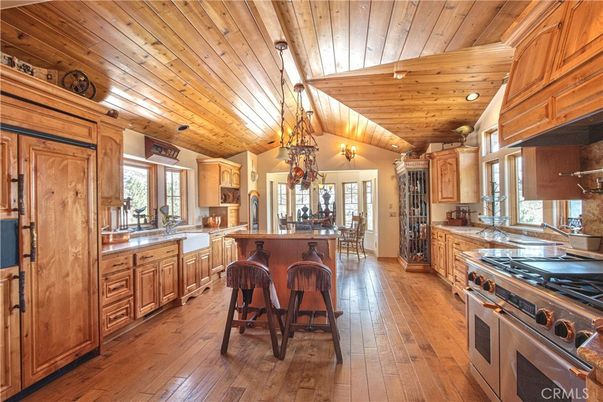 Chandelier, Dining room, Interior, Kitchen, Stainless Steel Appliances, Wooden Ceilings, Wood Texture Flooring