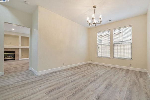Chandelier, Empty room, Fireplace, Interior, Recessed Lighting, Wood Texture Flooring