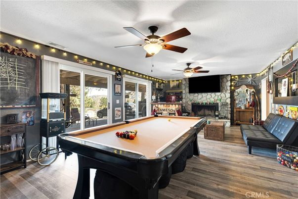 Billiard Table, Fireplace, Game Room, Interior, Stone Walls, Wood Texture Flooring