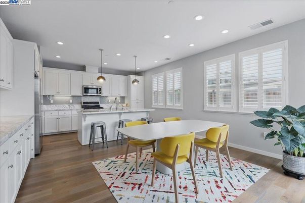 Dining room, Interior, Kitchen, Pendant Lights, Recessed Lighting, Stainless Steel Appliances, Wood Texture Flooring