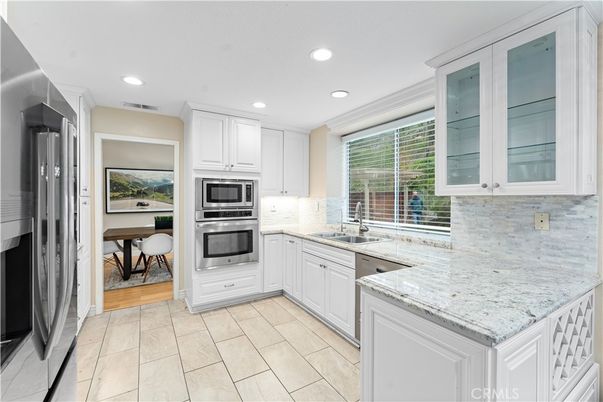 Dining room, Interior, Kitchen, Recessed Lighting, Stainless Steel Appliances, Wood Texture Flooring