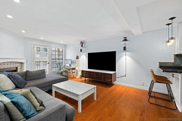 Dining room, Fireplace, Interior, Living room, Pendant Lights, Recessed Lighting, Wood Texture Flooring