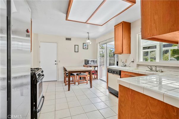 Dining room, Interior, Kitchen, Pendant Lights, Stainless Steel Appliances, Tile Countertops