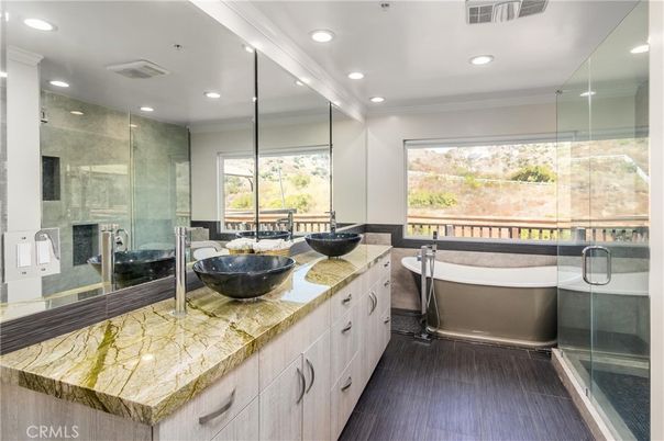 Bathroom, Dual Sink Vanities, Free Standing Baths, Glass Shower, Interior, Recessed Lighting, Wood Texture Flooring