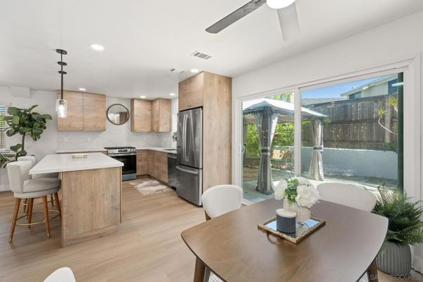 Dining room, Interior, Kitchen, Pendant Lights, Recessed Lighting, Stainless Steel Appliances, Wood Texture Flooring