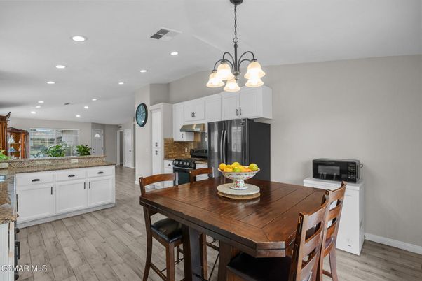 Chandelier, Dining room, Interior, Kitchen, Recessed Lighting, Stainless Steel Appliances, Wood Texture Flooring