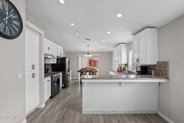 Dining room, Interior, Kitchen, Pendant Lights, Recessed Lighting, Stainless Steel Appliances, Wood Texture Flooring