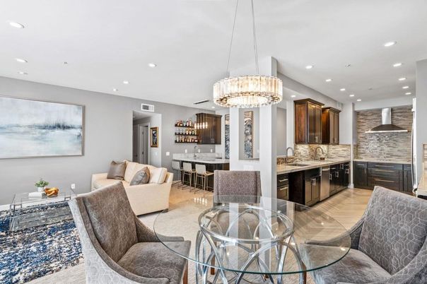 Chandelier, Dining room, Interior, Kitchen, Living room, Pendant Lights, Recessed Lighting, Stainless Steel Appliances, Wood Texture Flooring