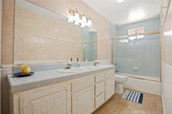 Bathroom, Dual Sink Vanities, Glass Shower, Interior, Recessed Lighting, Tile Countertops