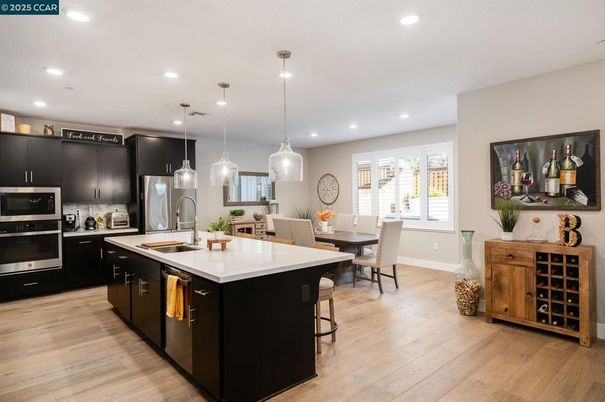 Dining room, Interior, Kitchen, Pendant Lights, Recessed Lighting, Stainless Steel Appliances, Wood Texture Flooring