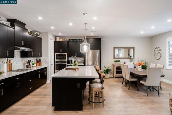 Dining room, Interior, Kitchen, Pendant Lights, Recessed Lighting, Stainless Steel Appliances, Wood Texture Flooring