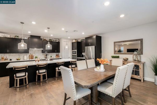 Dining room, Interior, Kitchen, Pendant Lights, Recessed Lighting, Stainless Steel Appliances, Wood Texture Flooring