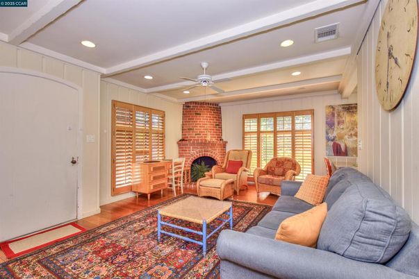 Fireplace, Interior, Living room, Recessed Lighting, Stone Walls, Wood Texture Flooring