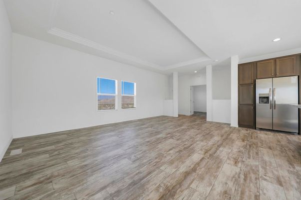 Empty room, Interior, Kitchen, Recessed Lighting, Stainless Steel Appliances, Wood Texture Flooring