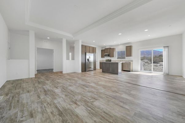 Empty room, Interior, Kitchen, Recessed Lighting, Stainless Steel Appliances, Wood Texture Flooring
