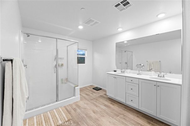 Bathroom, Dual Sink Vanities, Glass Shower, Interior, Recessed Lighting, Wood Texture Flooring